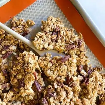 Maple Pecan Granola Clusters on a Baking Sheet