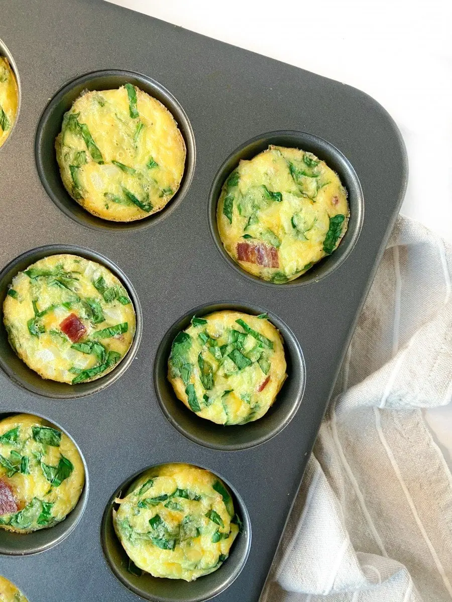 A muffin pan filled with mini frittatas.