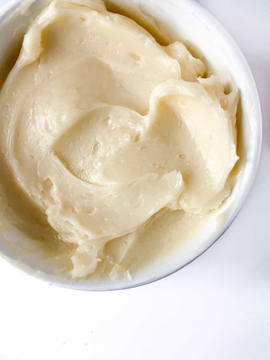 A white bowl of completed butter. 