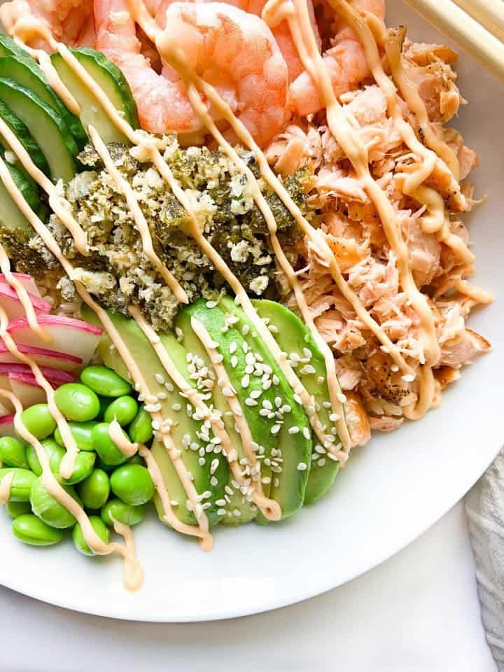 A Poke Bowl with cooked shrimp and salmon