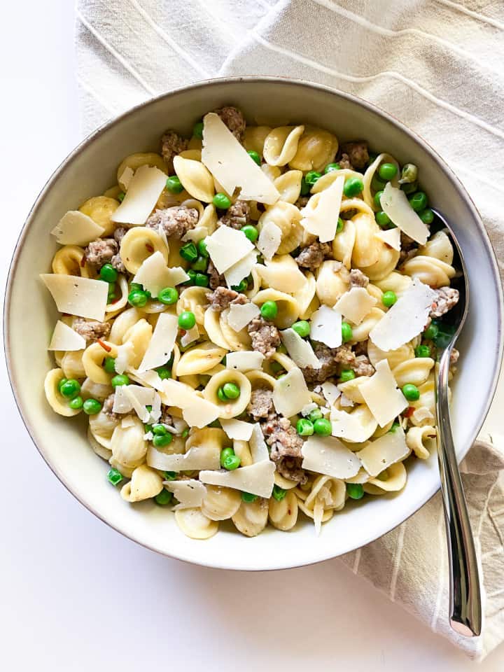 A completed recipe of this orecchiette pasta dish, garnished and served in a bowl. 