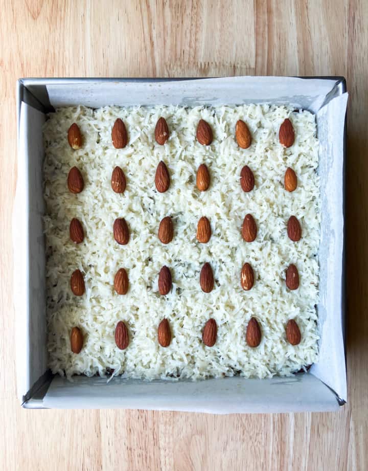 The inside layer of coconut filling and whole almonds.