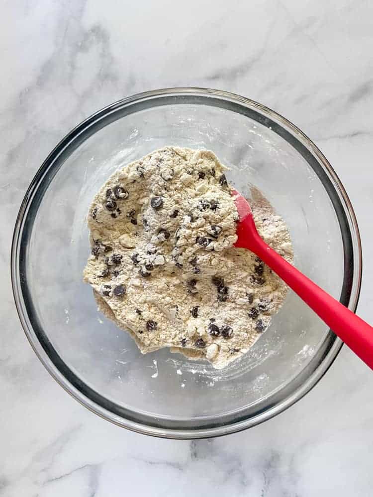 Chocolate chips stirred into butter-flecked flour.