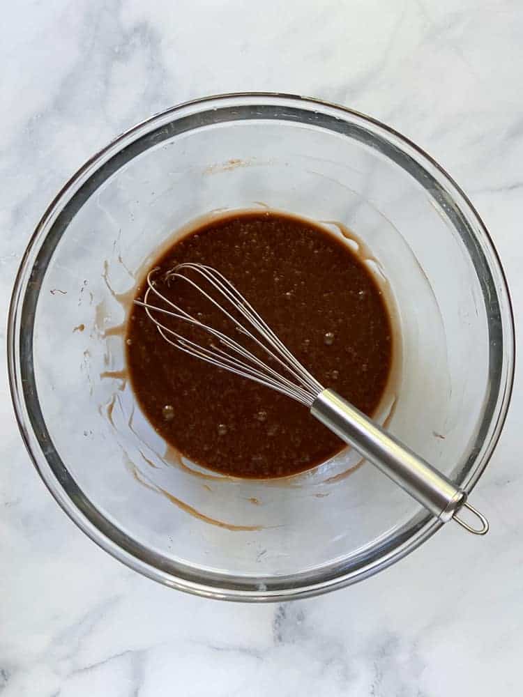 Nutella whisked into the butter-egg mixture with a whisk.