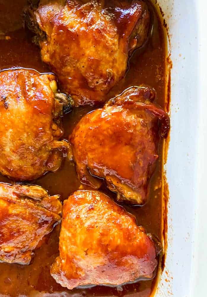 BBQ chicken thighs smothered in BBQ sauce in the slow-cooker.