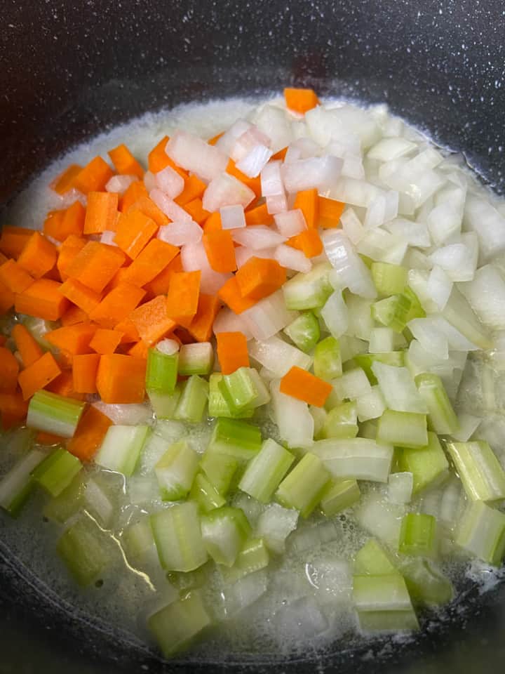 Mirepoix with melted butter in a saucepan.