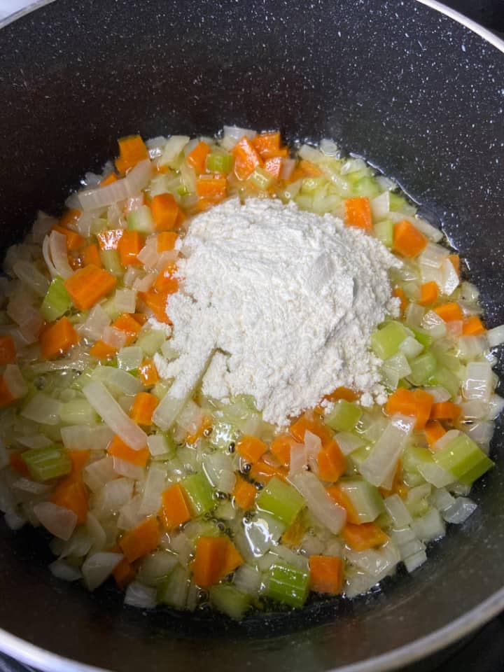 A saucepan with mirepoix, butter, and flour.