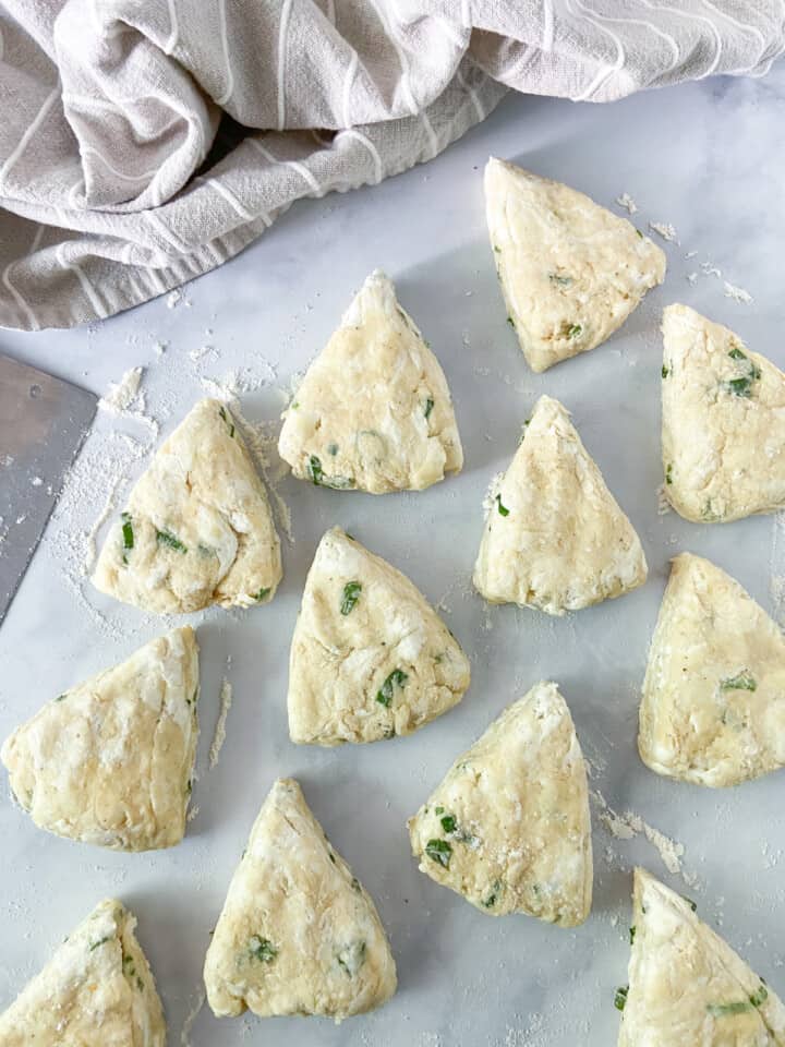 Scone dough cut into 12 triangles.