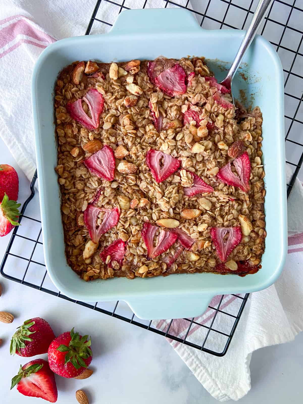 Strawberry baked oatmeal on a cooling rack.