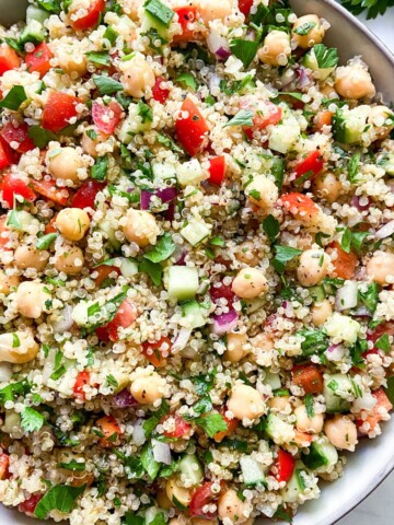 Quinoa salad with chickpeas in a large bowl.