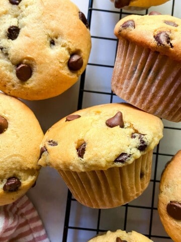 Buttermilk chocolate chip muffins on a wire rack.