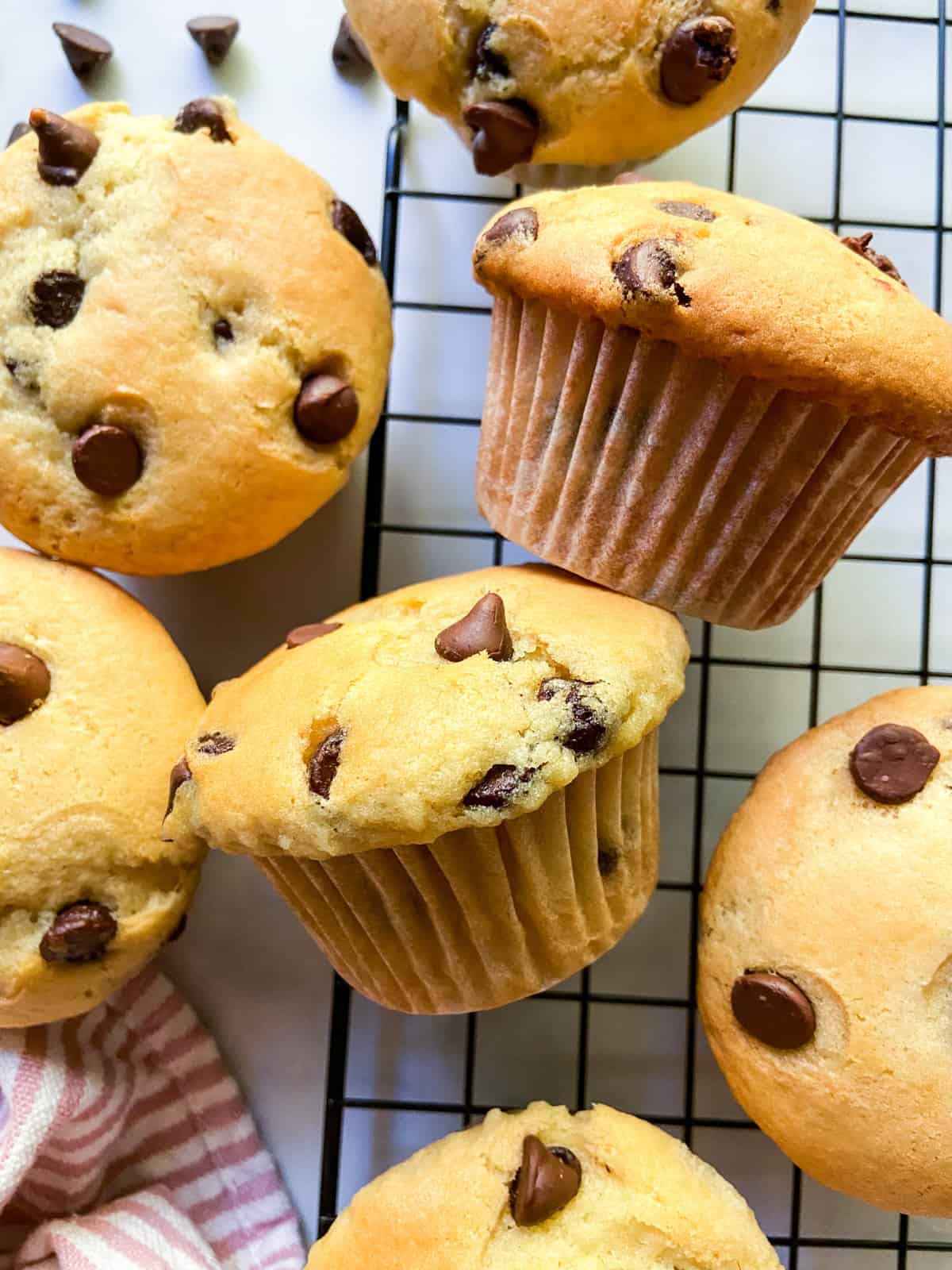 Buttermilk chocolate chip muffins on a wire rack.