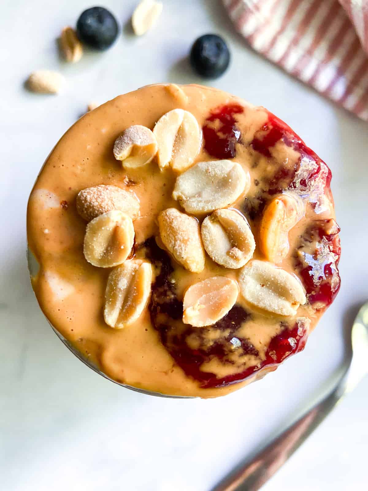 A close-up of pb and j overnight oats.