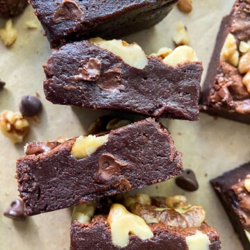 A close-up of fudgy double chocolate brownies with walnuts.