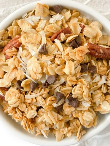 A small bowl full of coconut chocolate chip granola.