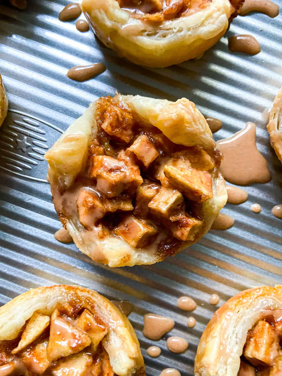 A mini apple pie with maple cinnamon glaze.