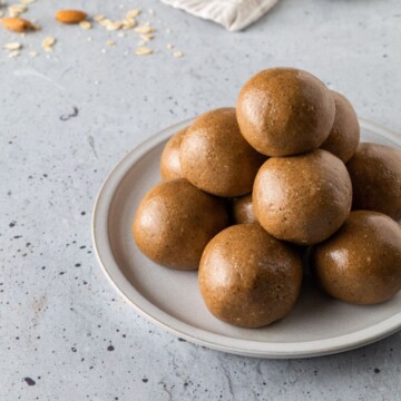 A small plate full of stacked protein balls.