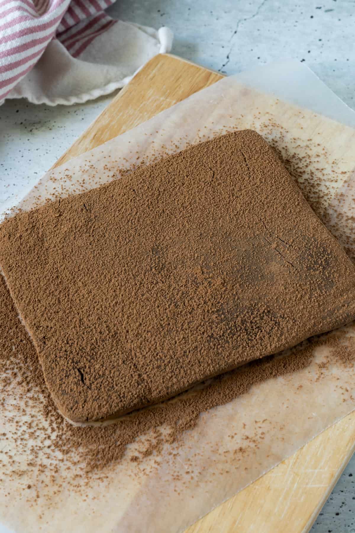 The truffle mixture formed into a rectangle and dusted in cocoa powder.
