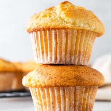 Two muffins stacked atop each other.