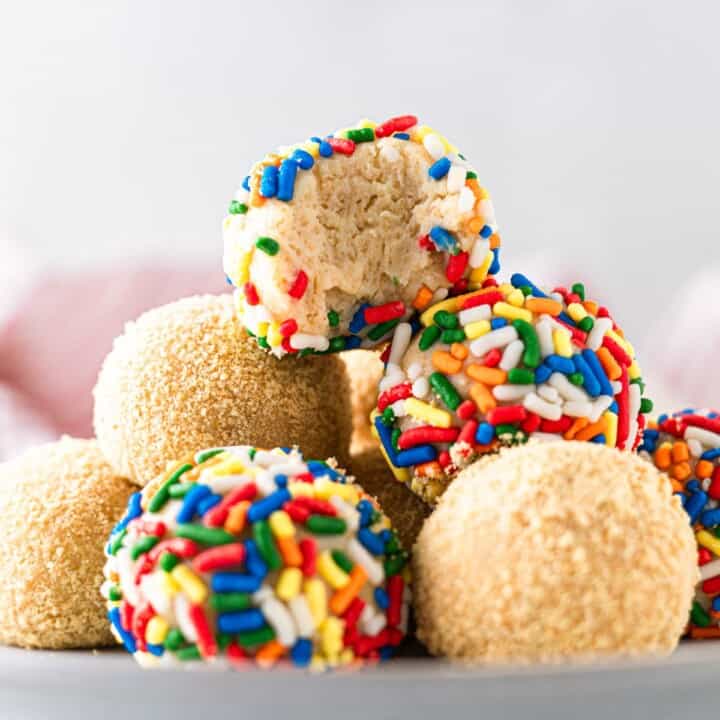 A stack of cheesecake balls on a small plate.