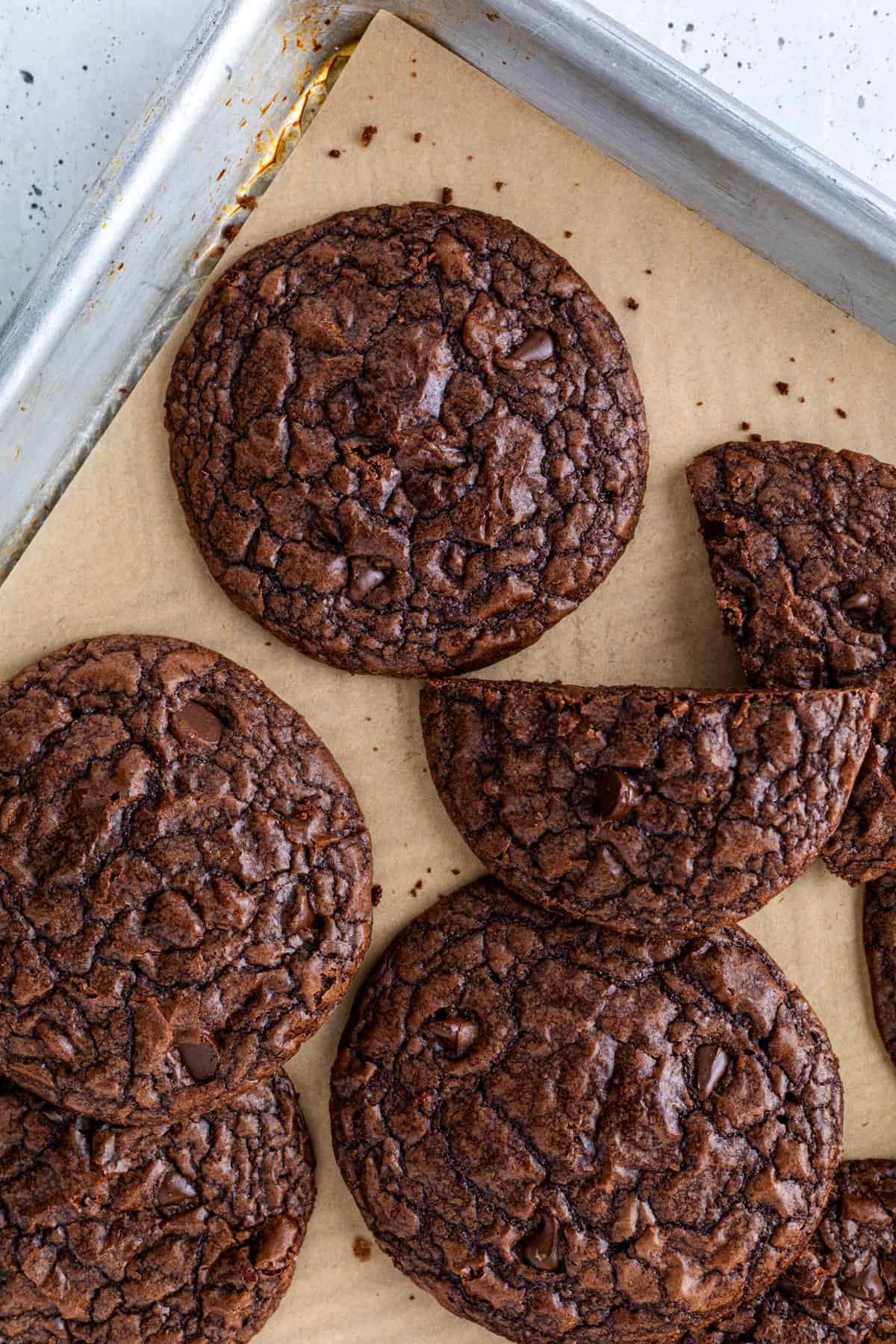 Brownie cookies on a parchment-lined tray.
