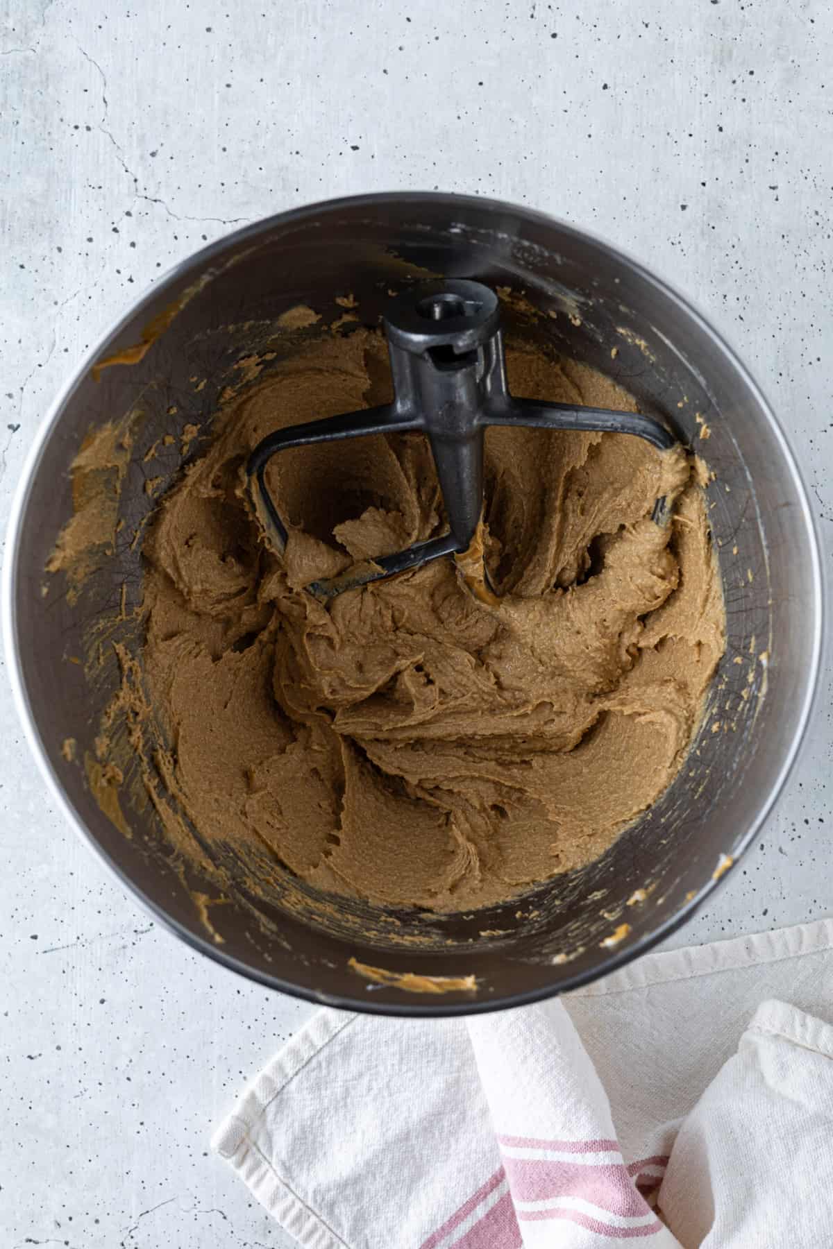 Whipped cookie butter, butter, and sugar in a mixer bowl with the paddle attachment.