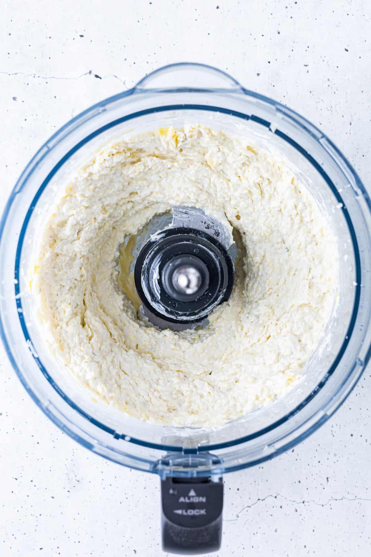 Dip blended in a food processor container.