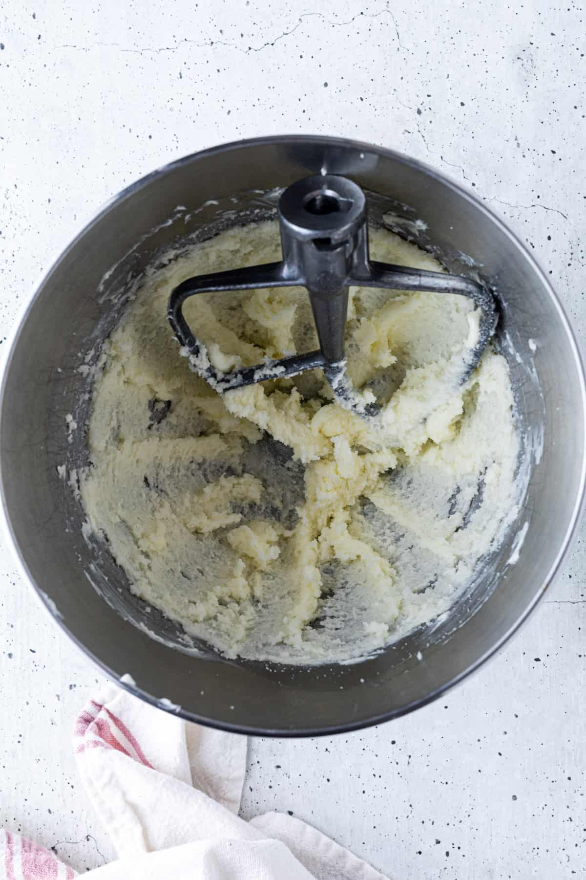 Whipped butter and sugar in a bowl with the paddle attachment.