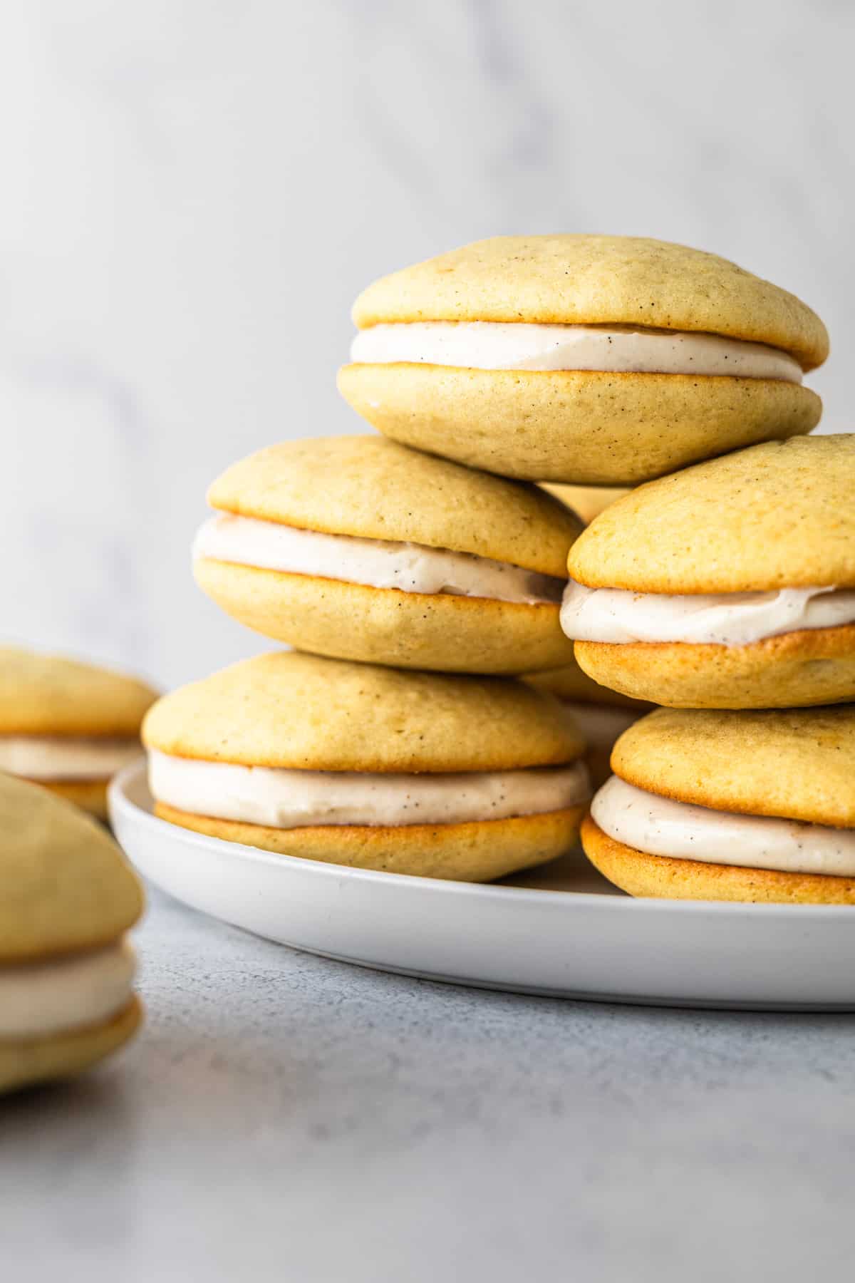 A stack of whoopie pies on a plate.